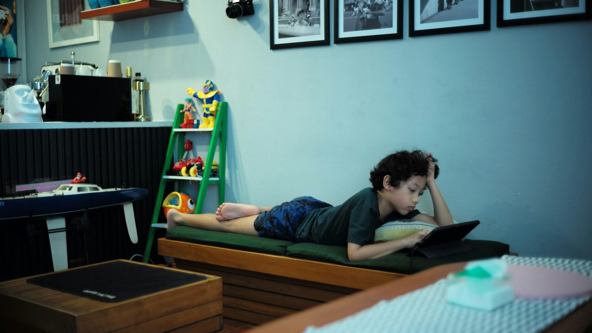 A tired child relaxing at home after school