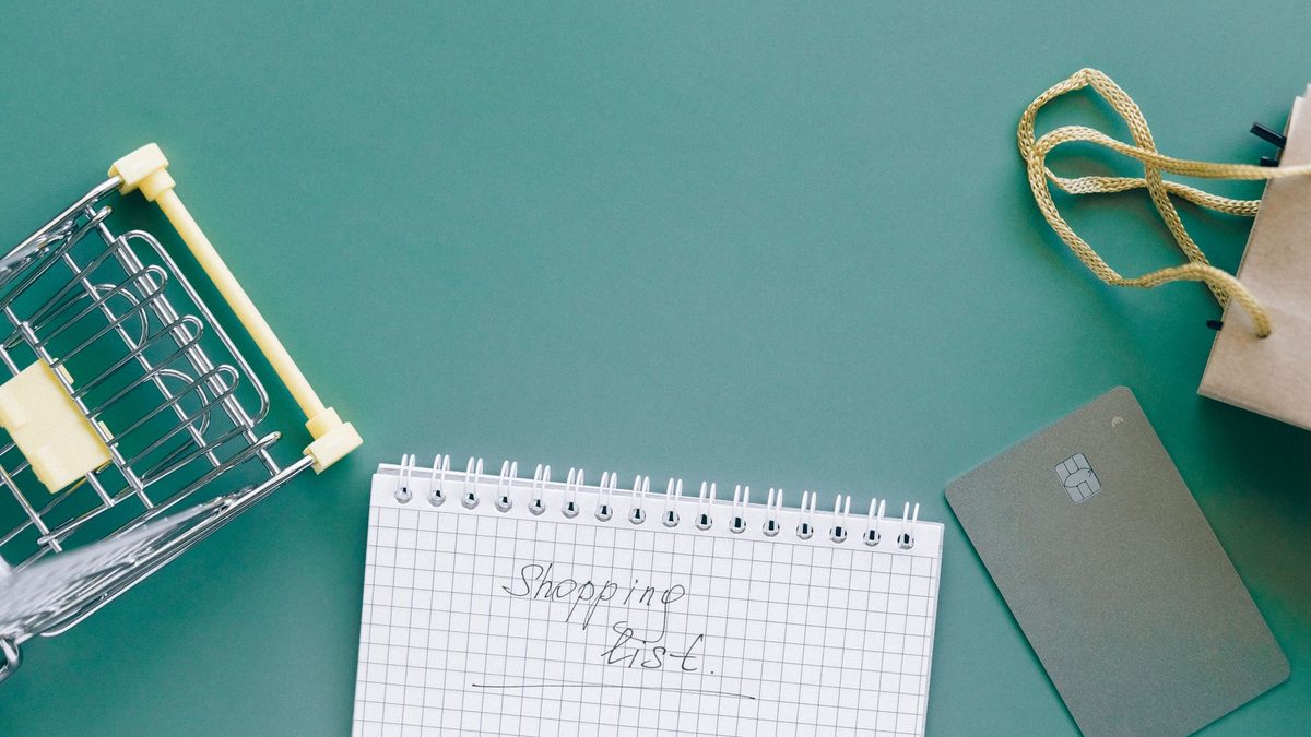 A handwritten back to school shopping list in a notebook