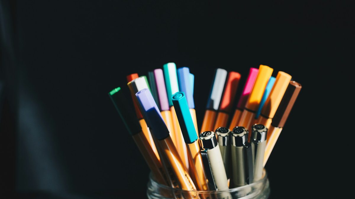 A collection of pencils standing together in a desk container