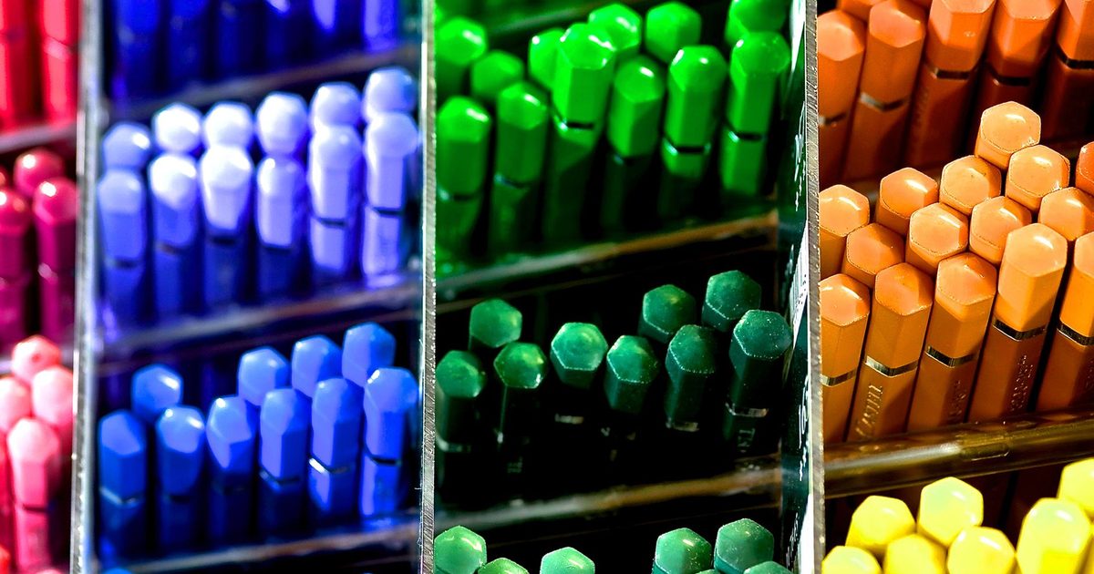 A row of different coloured pencils lined up together