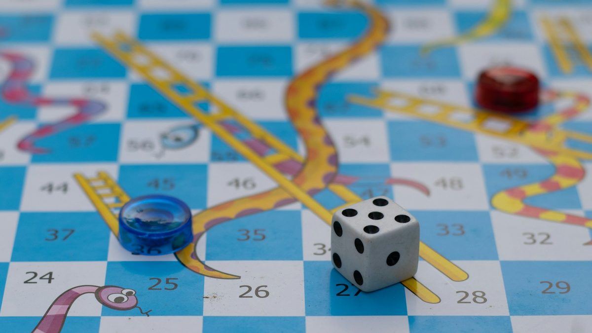 Close-up of dice resting on a board game during play