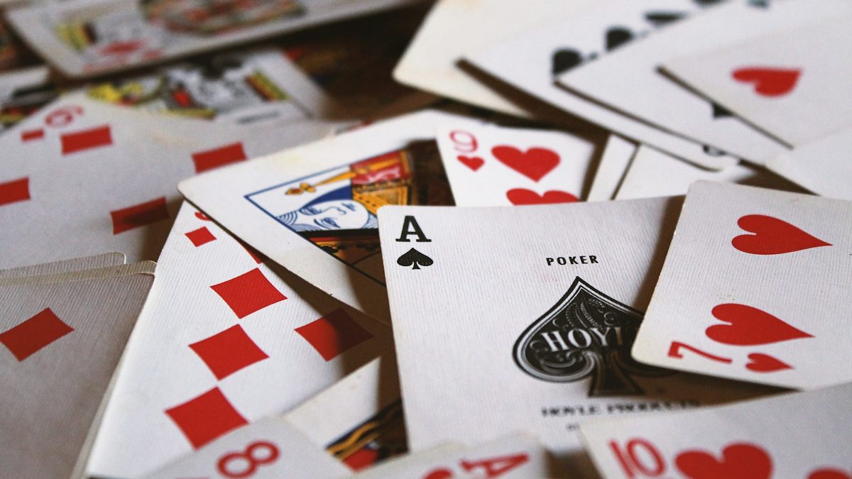 Playing cards laid out on a small table while travelling