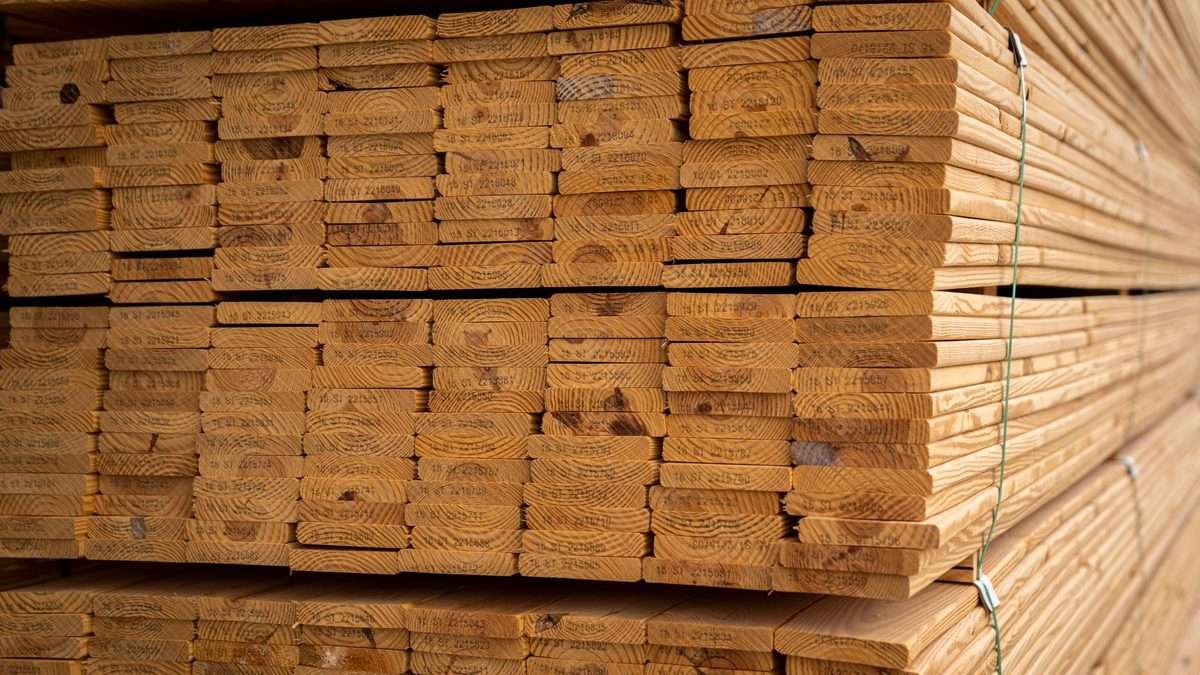 Stacked planks of cedar timber showing straight grain
