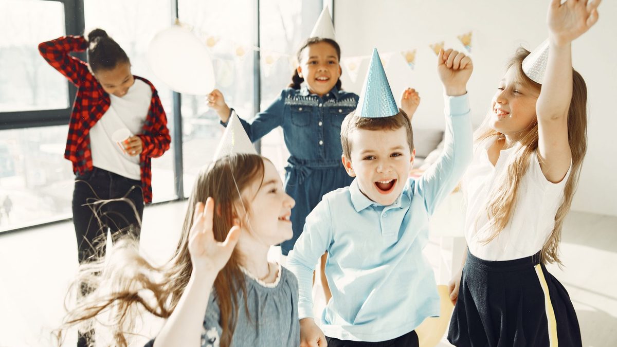 Children dancing together at a birthday party