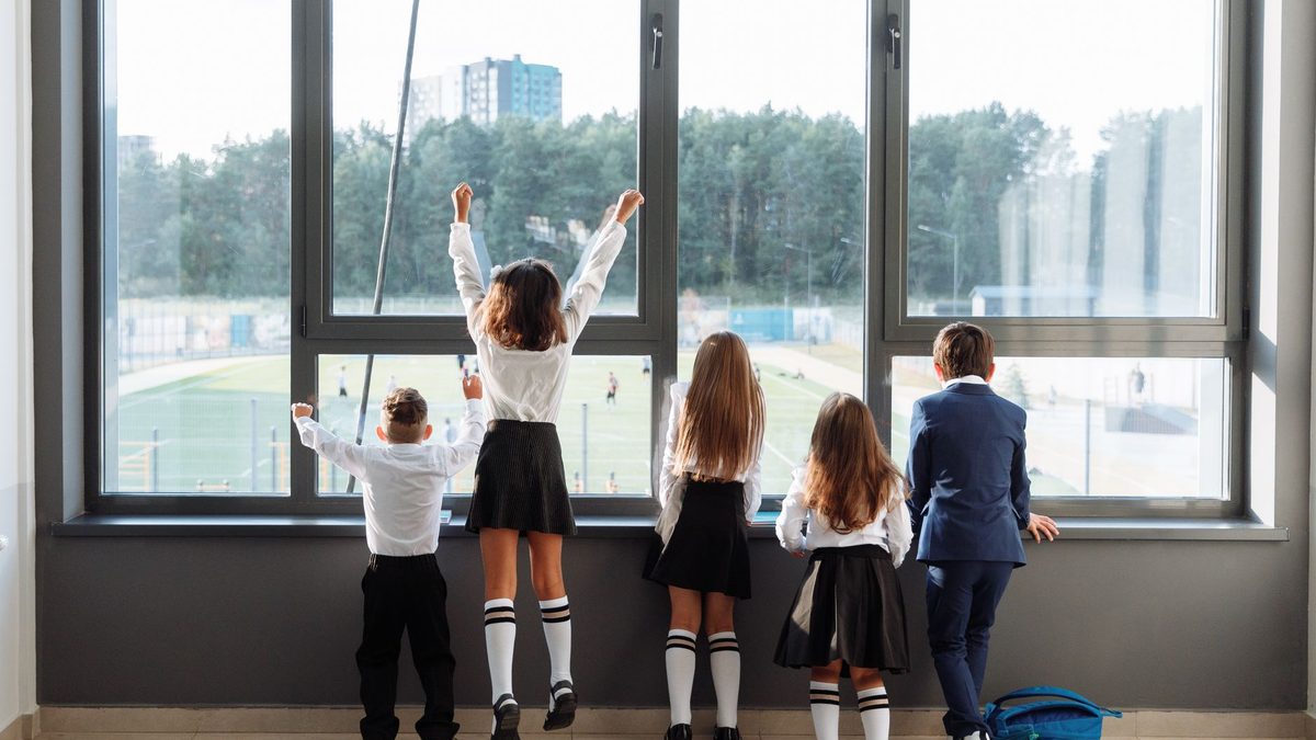 A class of children celebrating together indoors