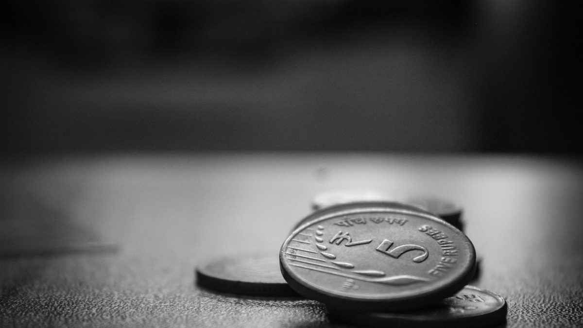A single coin resting on a flat surface