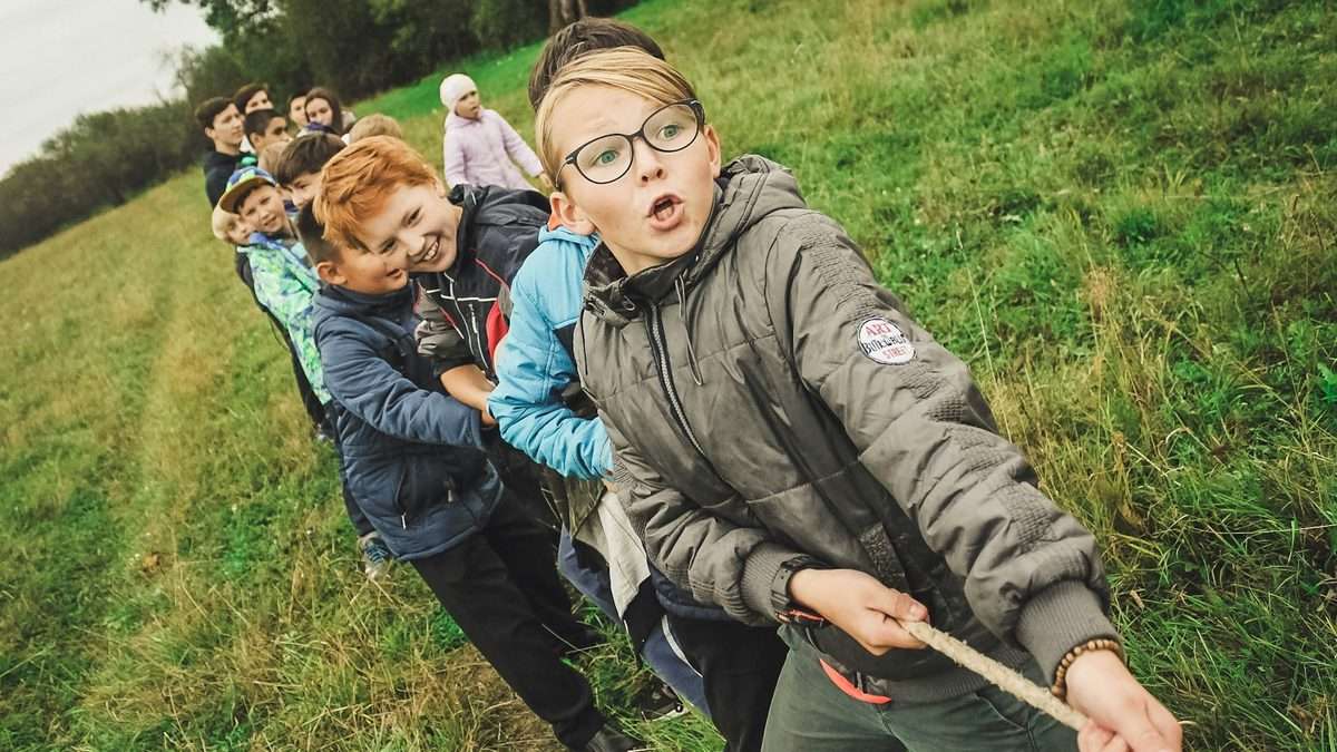 Children working together collaboratively on a game