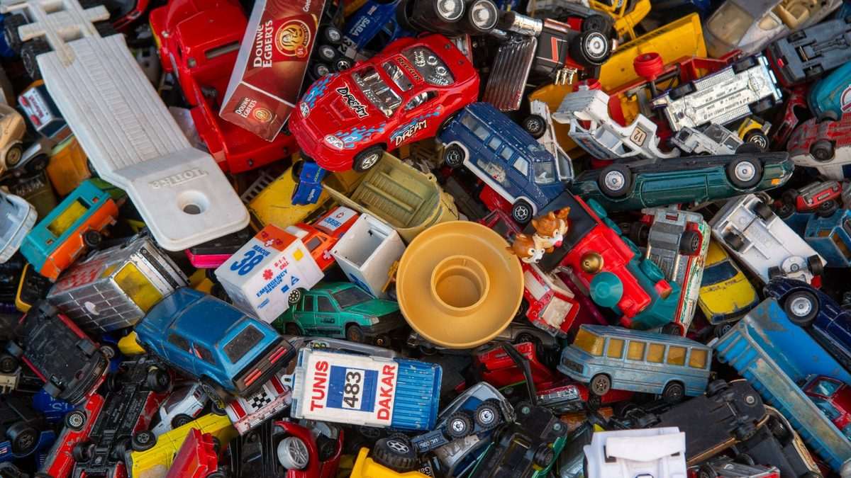 A pile of small cheap plastic toys of the kind used to fill prize boxes