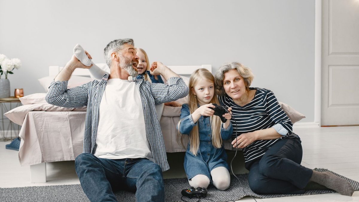 A family playing a game together at home around a table