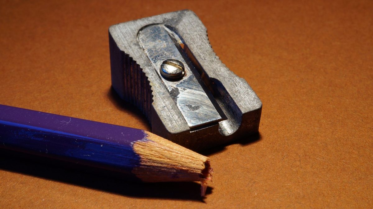Macro view of a pencil's metal ferrule and eraser