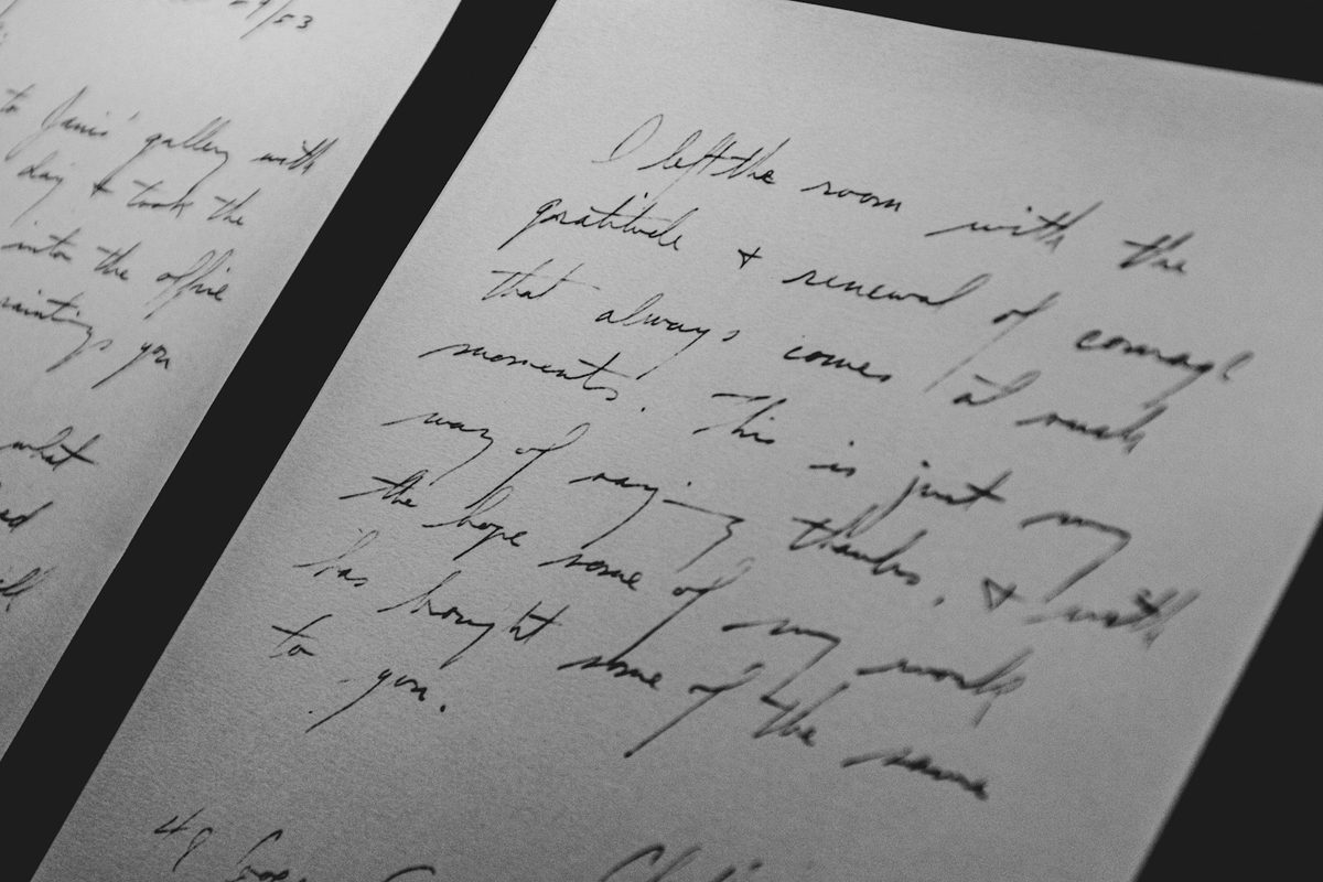 A page of neat joined handwriting photographed at an angle