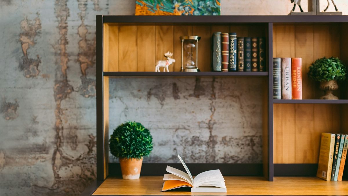 Closed books on a tidy desk with a school bag packed