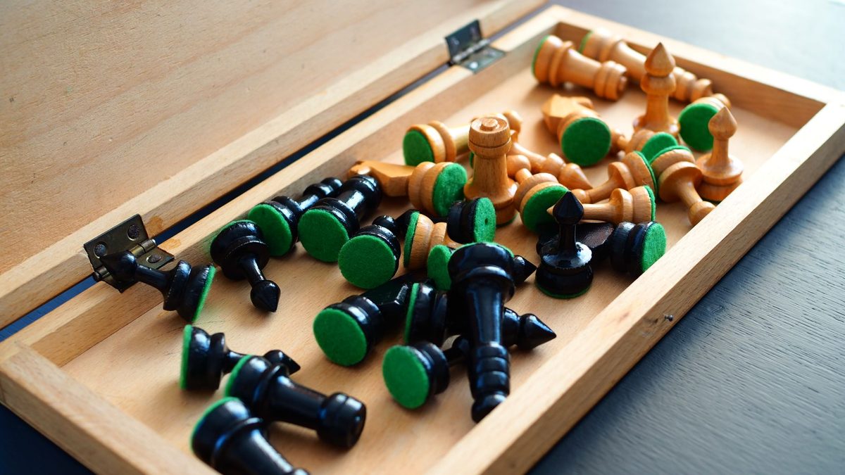 Small wooden game pieces and tokens photographed close up
