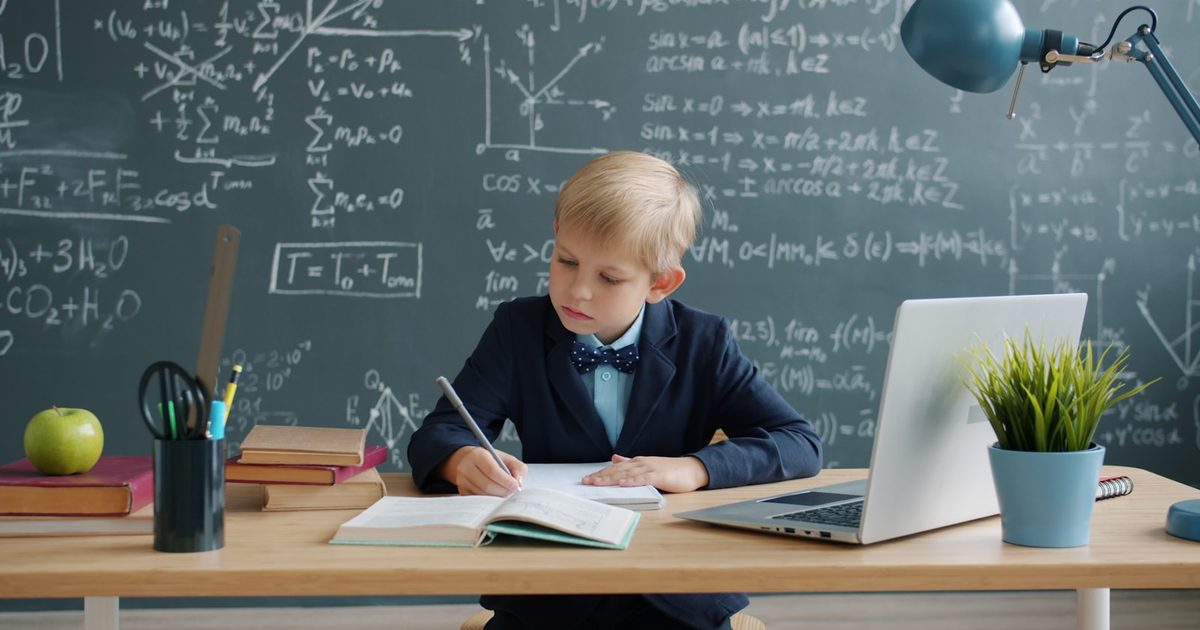 A pupil who has finished their work sitting at a school desk