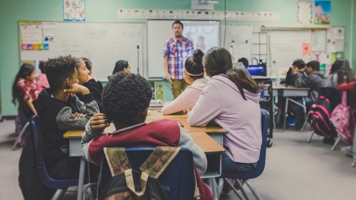 A primary school classroom with pupils and their teacher