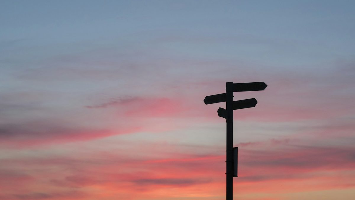 A signpost with arrows pointing in different directions