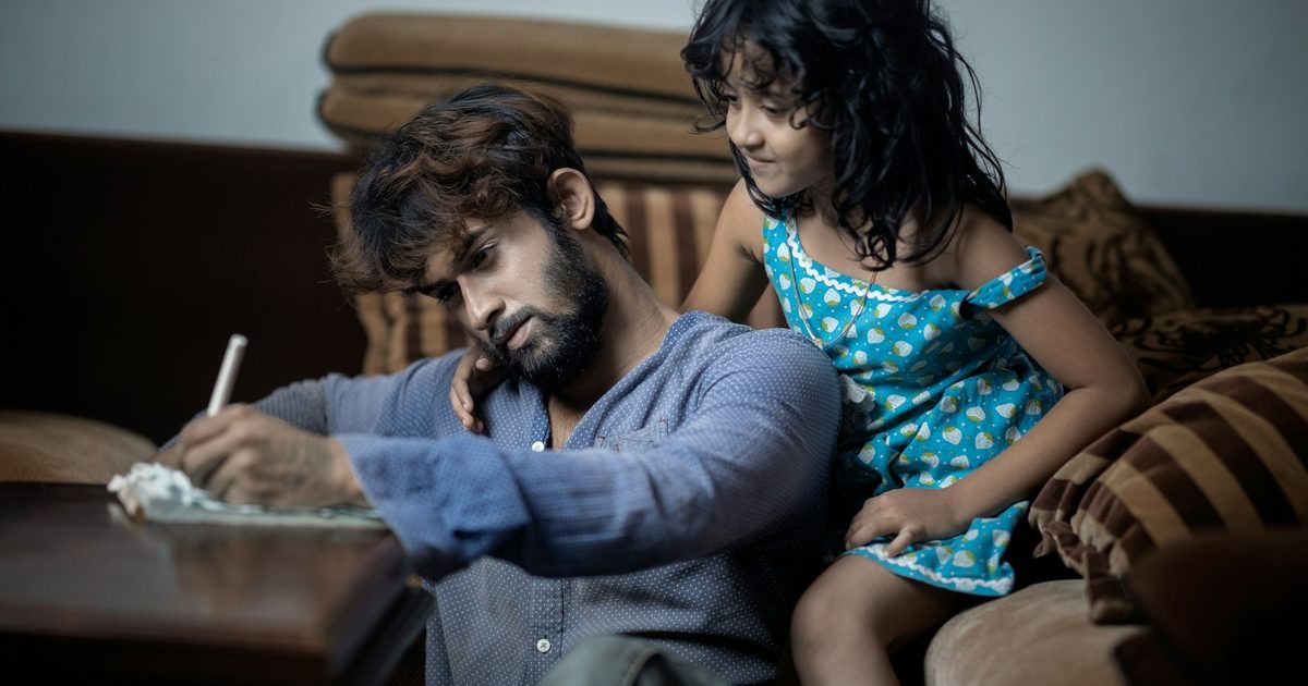 A child doing homework at a table at home
