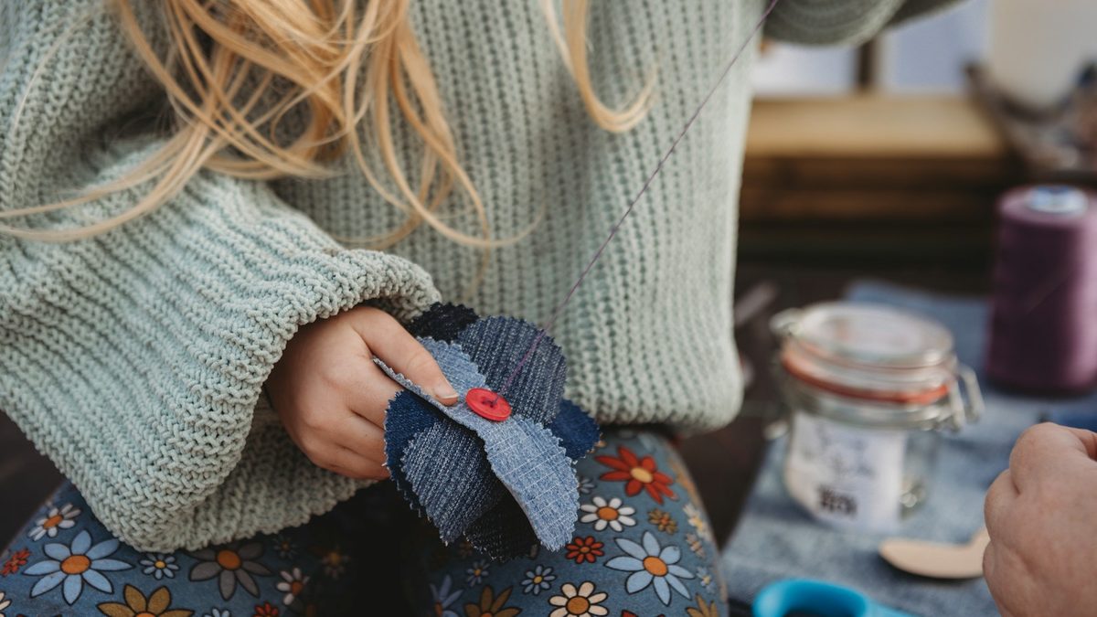A child using scissors and school tools at a desk