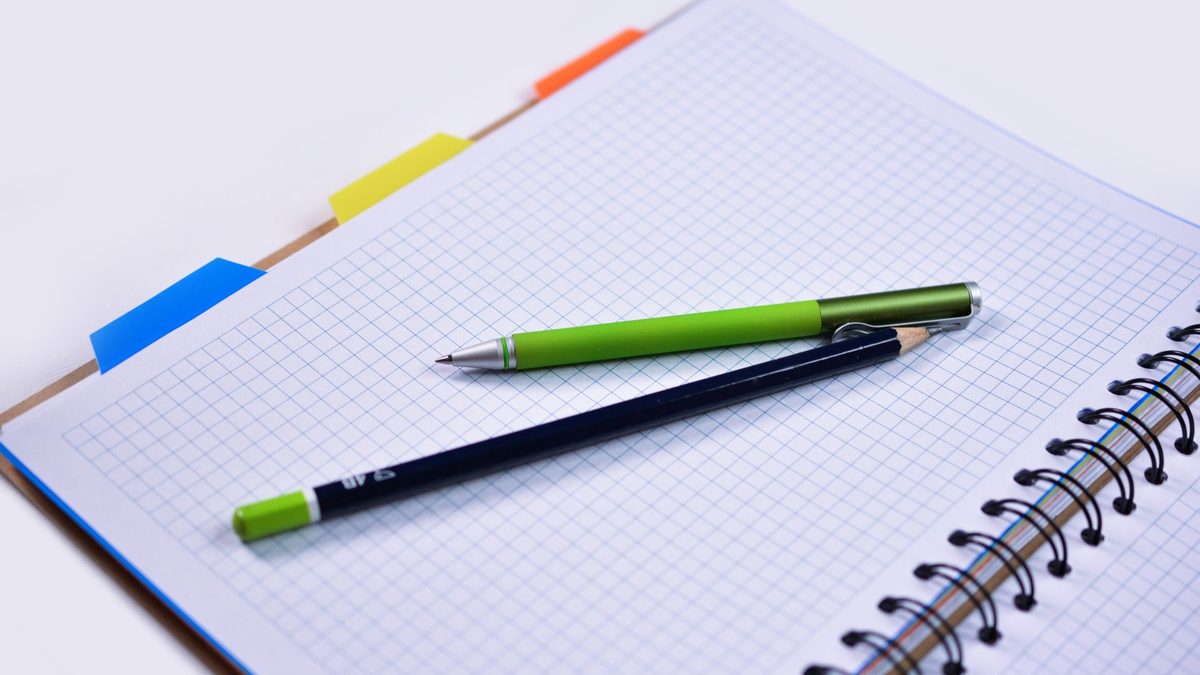 Lined paper and squared graph paper shown together