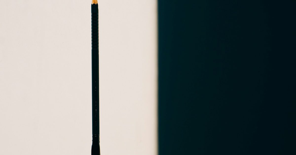 A mechanical pencil and a wooden pencil shown side by side