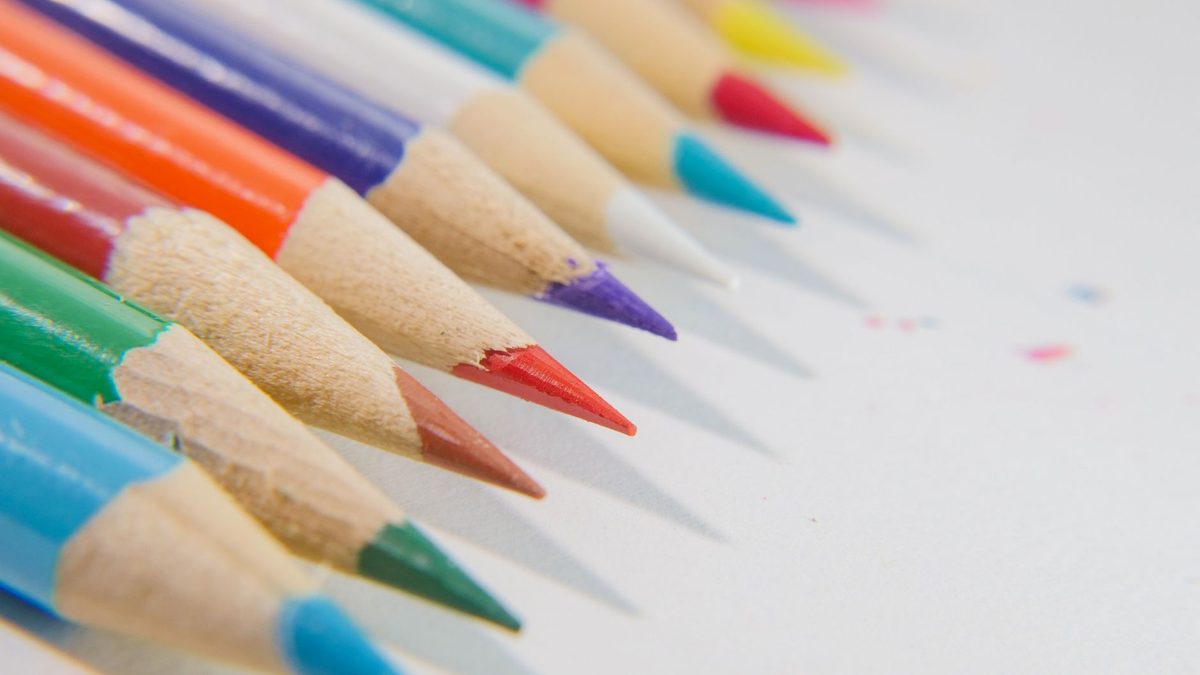 Brightly painted and lacquered pencils photographed close up
