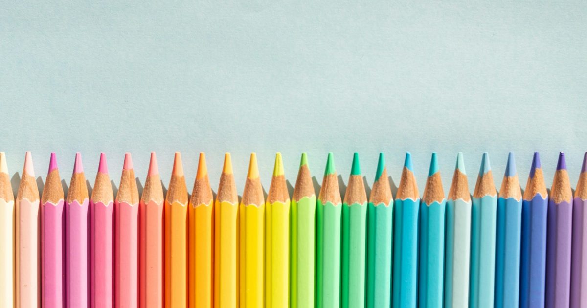 A group of sharpened pencils fanned out on a bright background