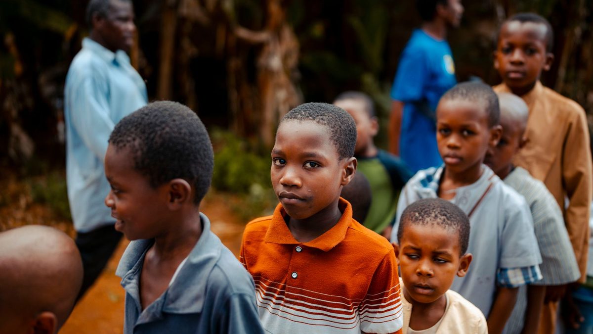 Children waiting in a line with nothing to do