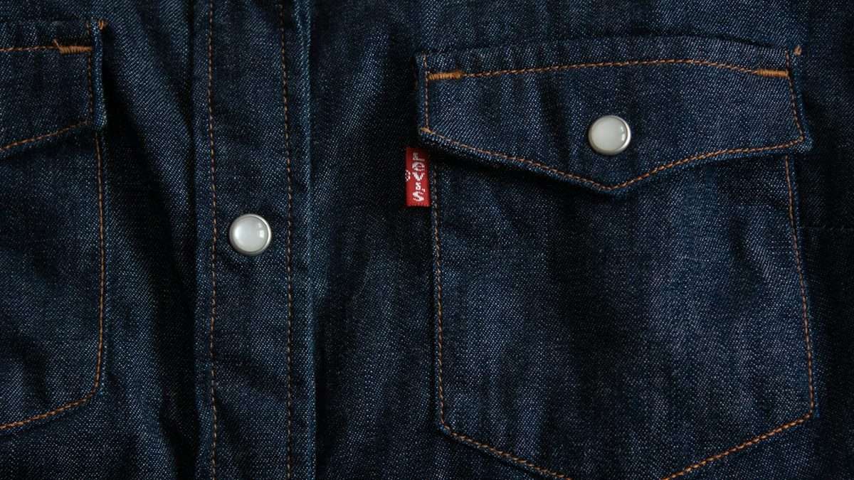 A pencil clipped to a notebook in a pocket