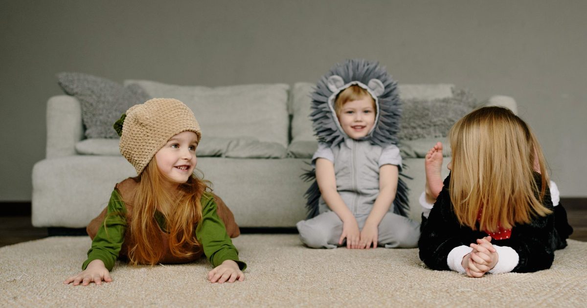 Children playing indoors at home on a wet day