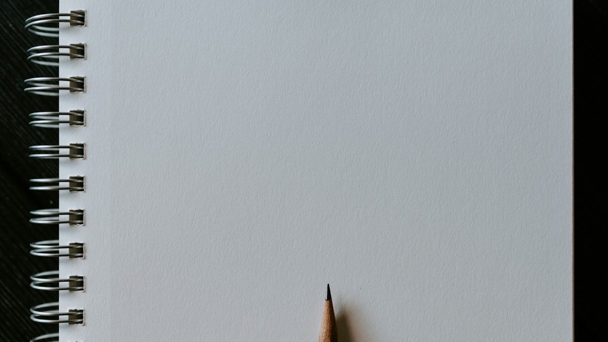A blank sketchbook page with a textured surface