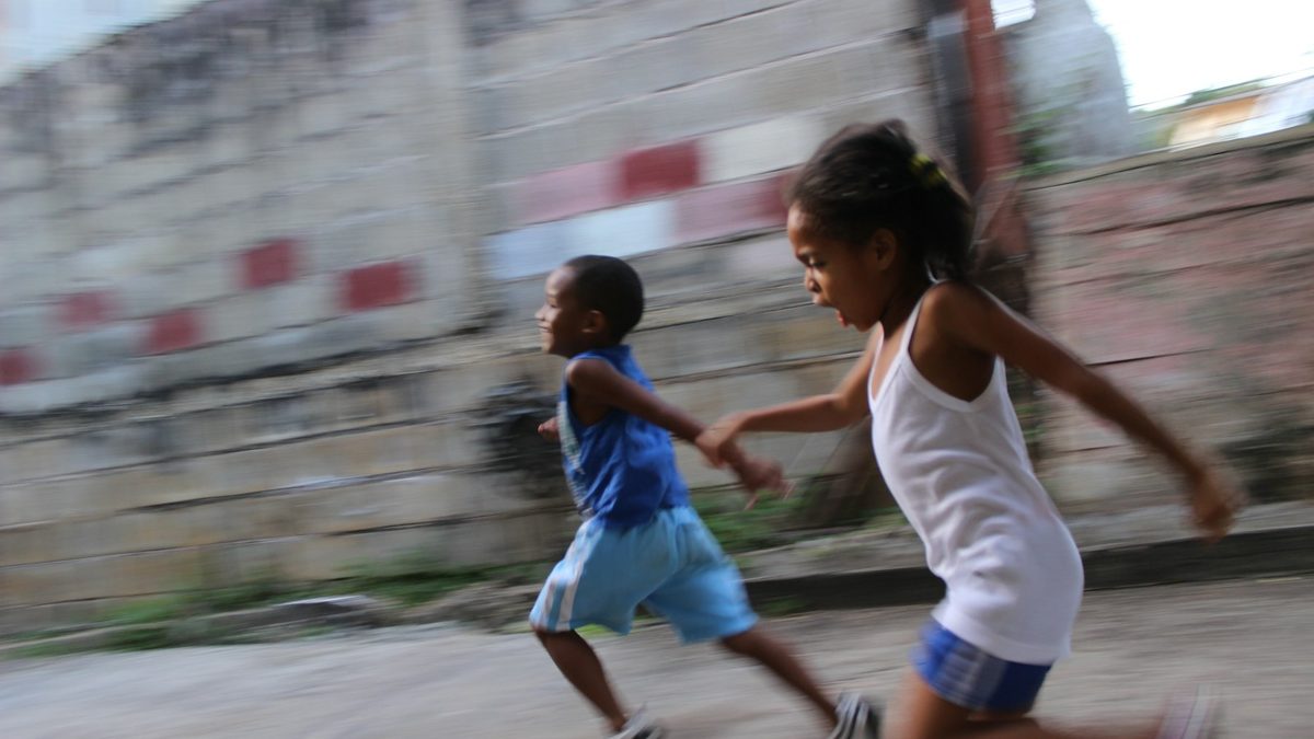 A child skipping with a rope outdoors