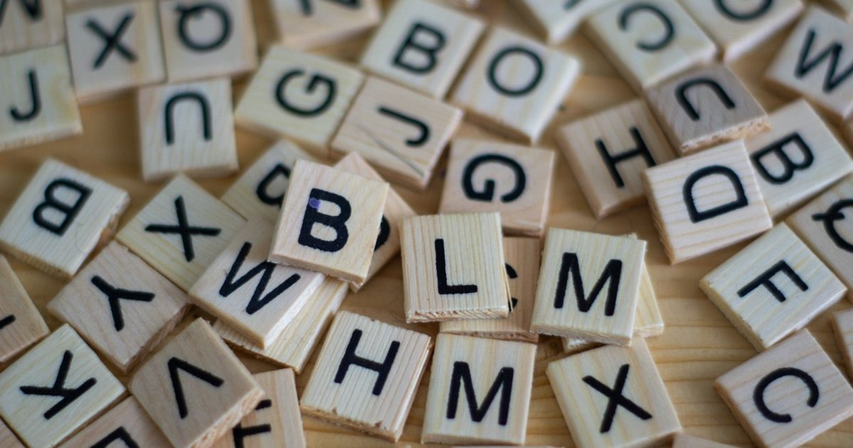 Alphabet letter tiles arranged to spell a word