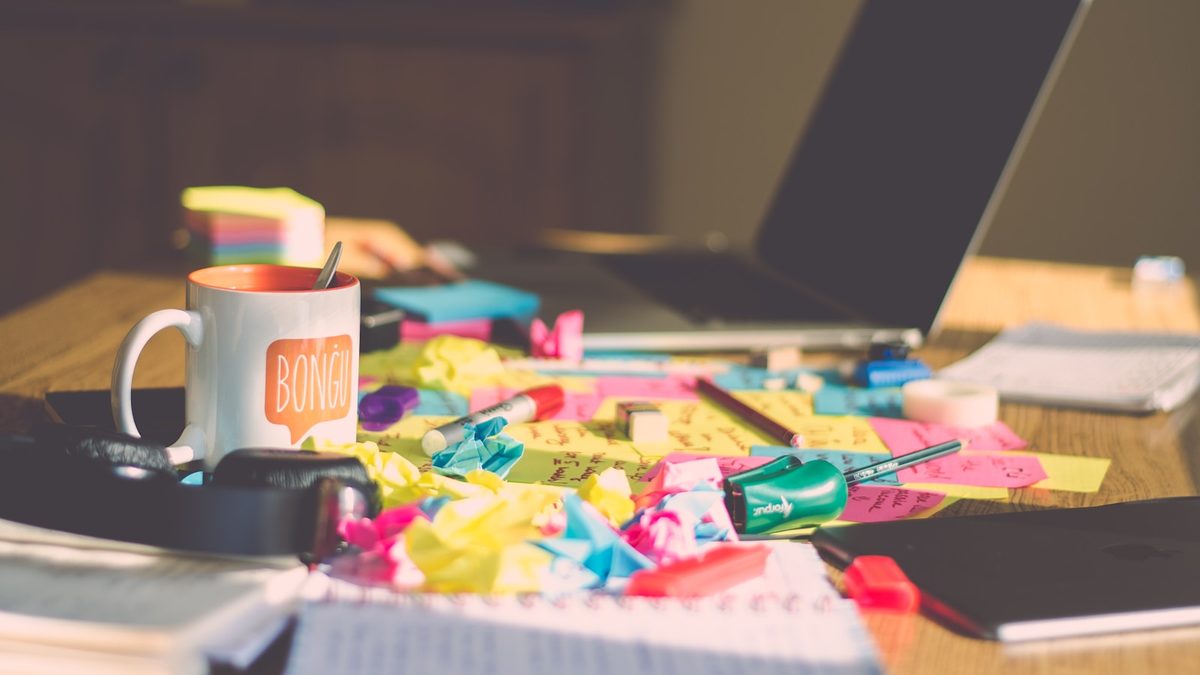 Scattered stationery items spread across a desk