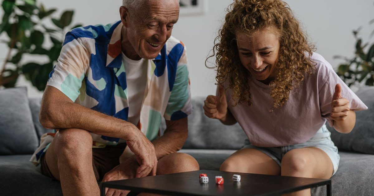 A child rolling dice on a table during a probability activity
