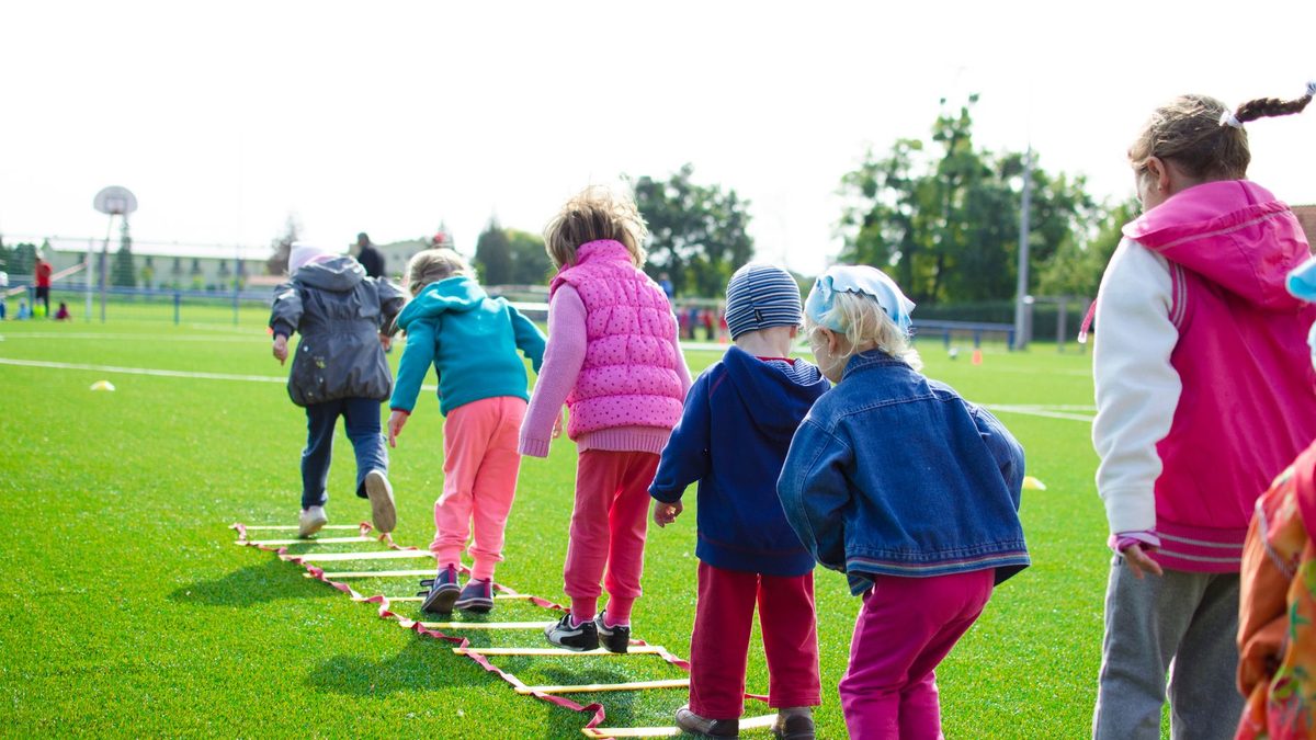 Children playing a team game together in groups