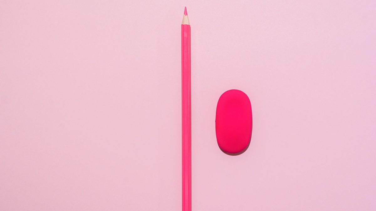 The pink eraser on the end of a pencil in close detail