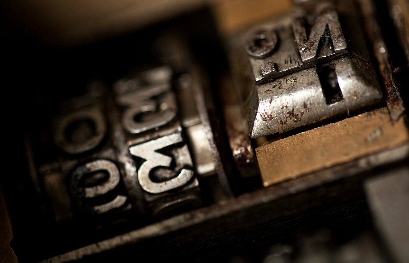Metal letterpress type blocks showing raised printed numerals